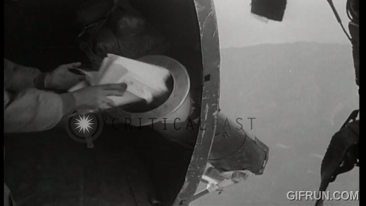 A_Korean_in_a_C47_Skytain_places_leaflets_in_a_tube_along_s(1).gif.75d76ddc28c147985d76e49dc83fdea0.gif